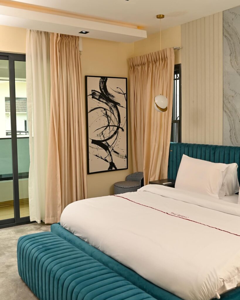 Fresh, crisp white bed linens and fluffy pillows on a comfortable bed.