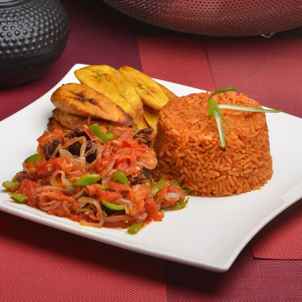 A spacious modern kitchen with a large refrigerator and microwave.